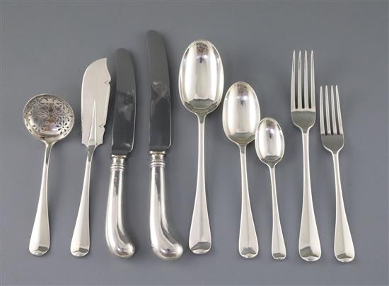 A late Victorian canteen of silver Hanovarian rat tail pattern flatware by Goldsmiths & Silversmiths Co, with velvet pouches.